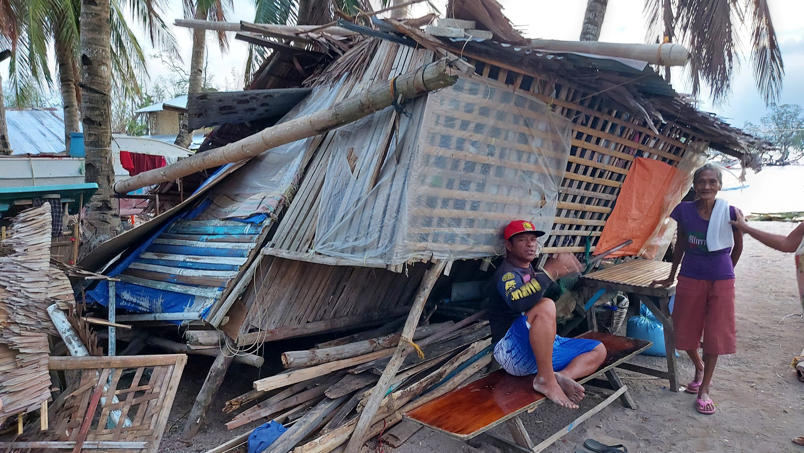 A woman with a disability lives alone in this mostly destroyed house.